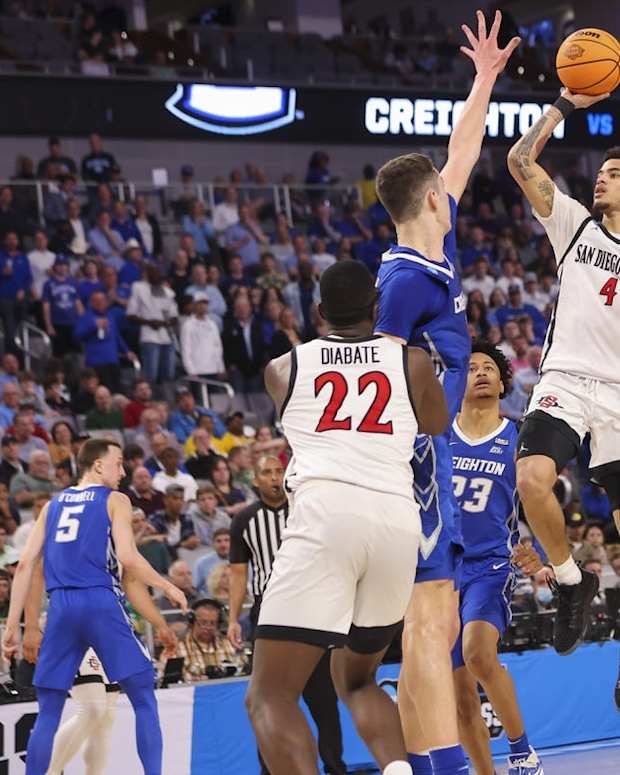 Mar 17, 2022; Fort Worth, TX, USA; San Diego State Aztecs guard Trey Pulliam (4) shoots over Creighton Bluejays center Ryan Kalkbrenner (11) during the second half in the first round of the 2022 NCAA Tournament at Dickies Arena. Mandatory Credit: Kevin Jairaj-USA TODAY Sports